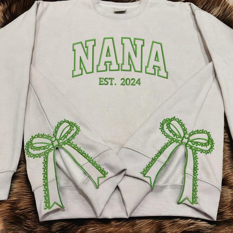 Custom Nana Est Embroidered Christmas Bow Embellished Shirt, Colorful Custom Side Bow Cut-Out Sweatshirt, Christmas Gift Hoodie